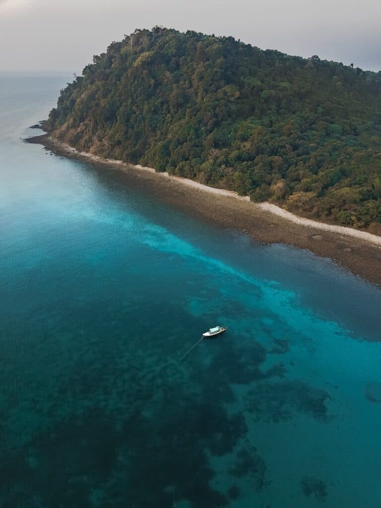 Aerial Photography Of Boat Sailing Near Island bahamas
